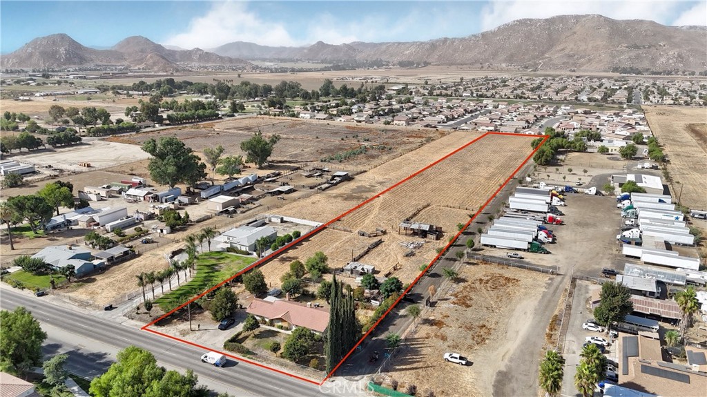 an aerial view of residential houses and outdoor space