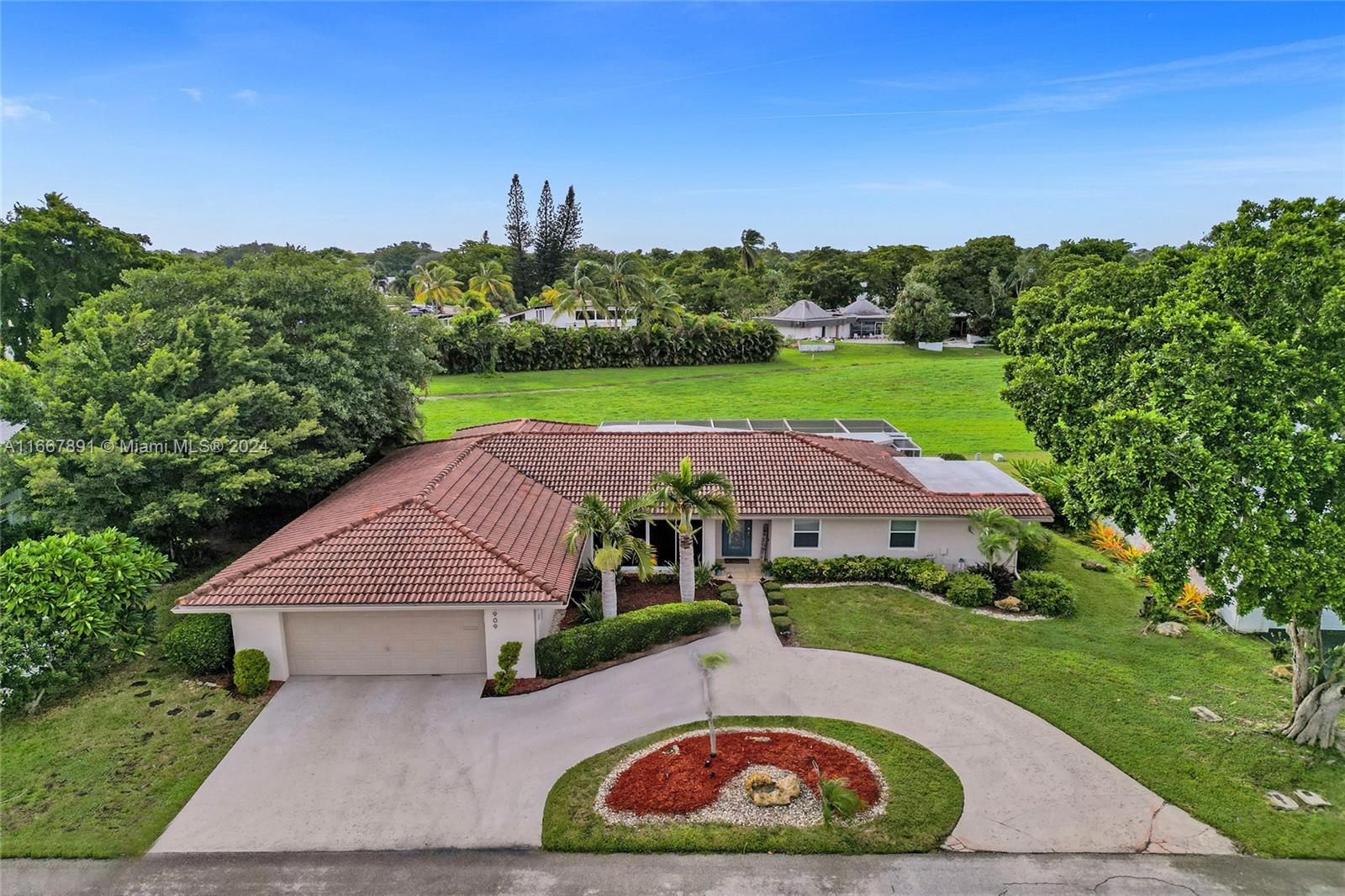 an aerial view of house with yard swimming pool and outdoor seating