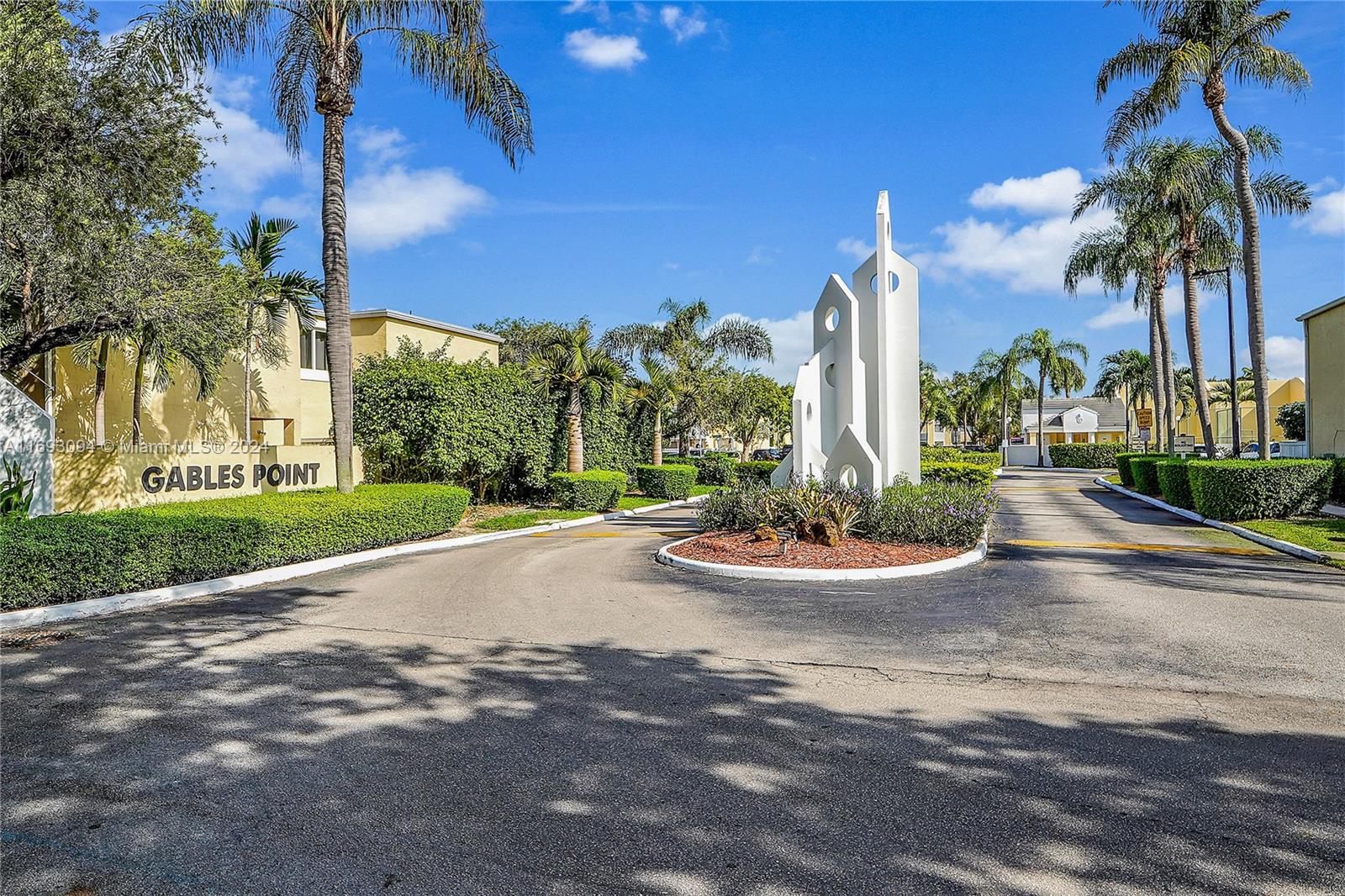 a view of a park with palm trees