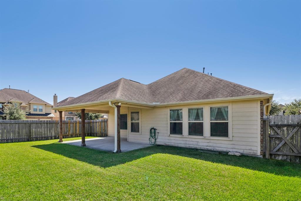 Large backyard with covered patio