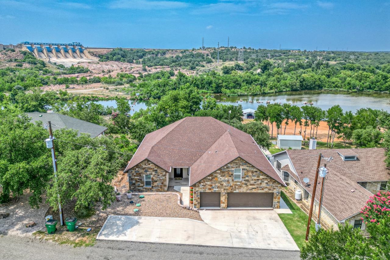 an aerial view of a house with a lake view