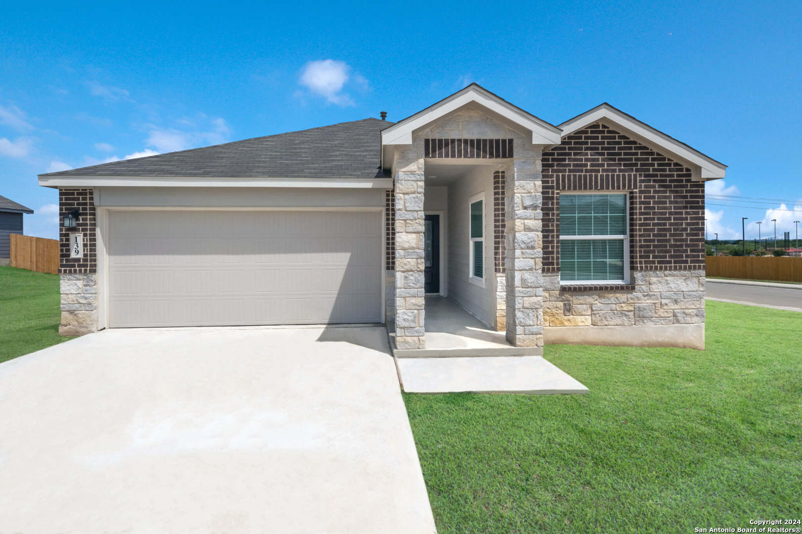 a front view of a house with a yard