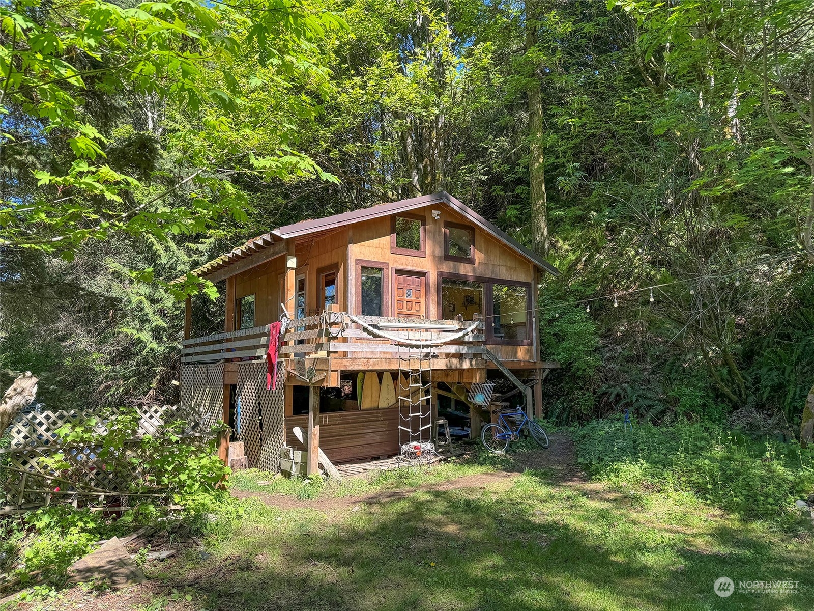 a view of house with a yard