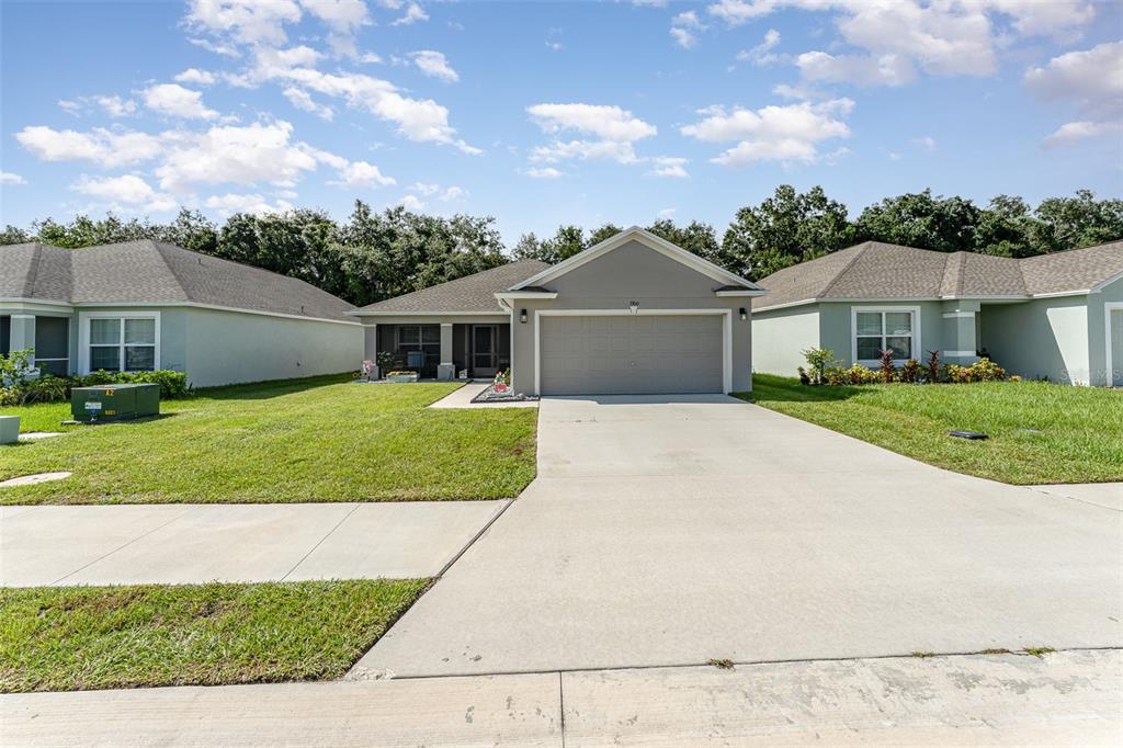 front view of a house with a yard