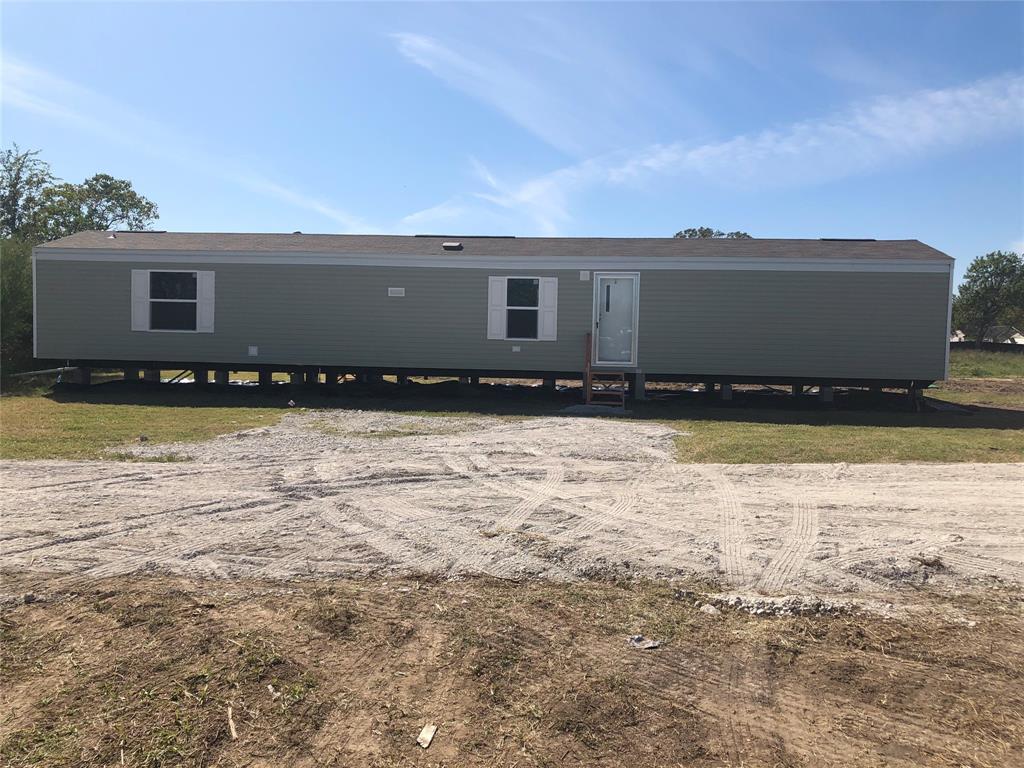 Front Door of first trailer 3 bdrm 2 bath facing pond on Ranch