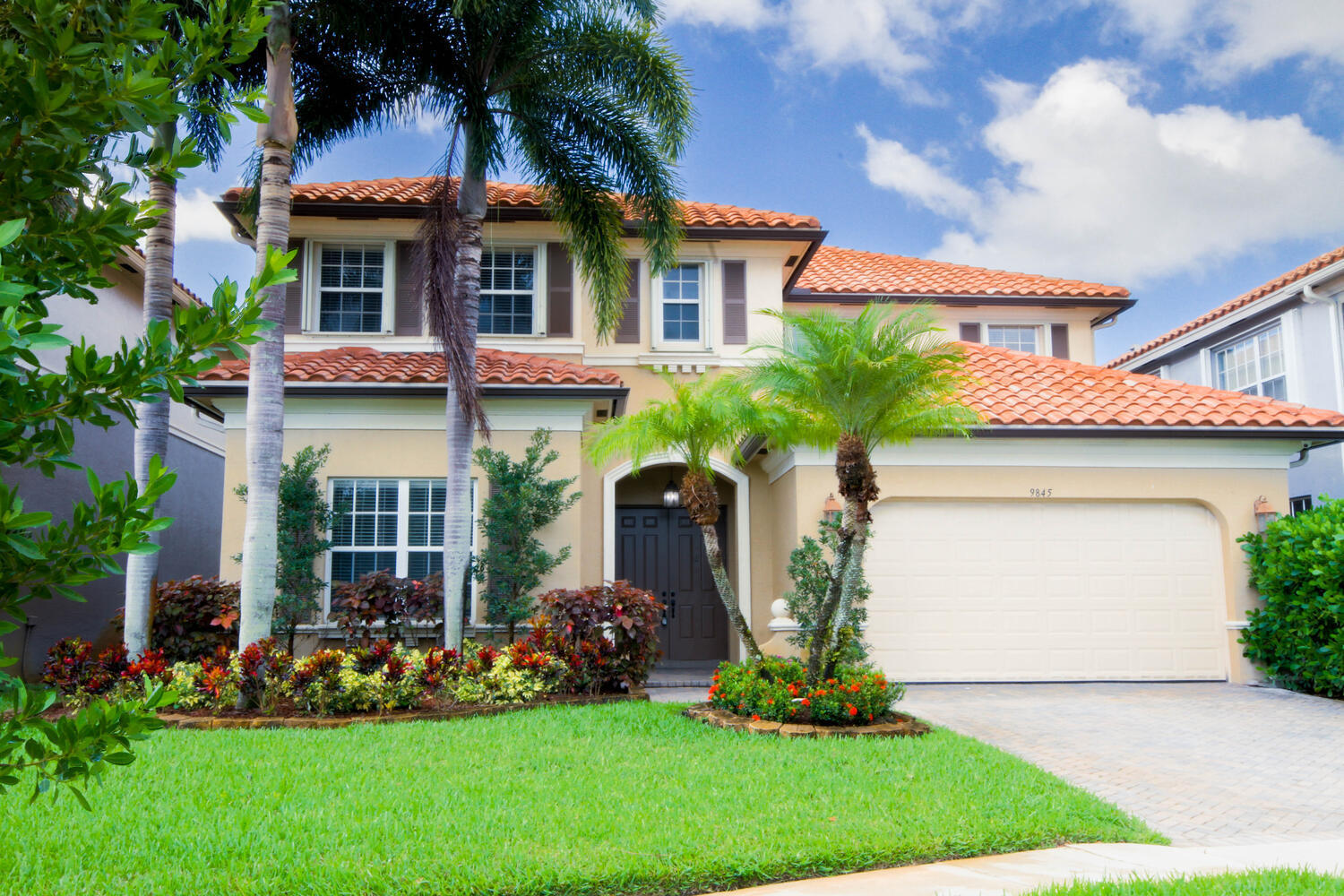 a front view of a house with garden