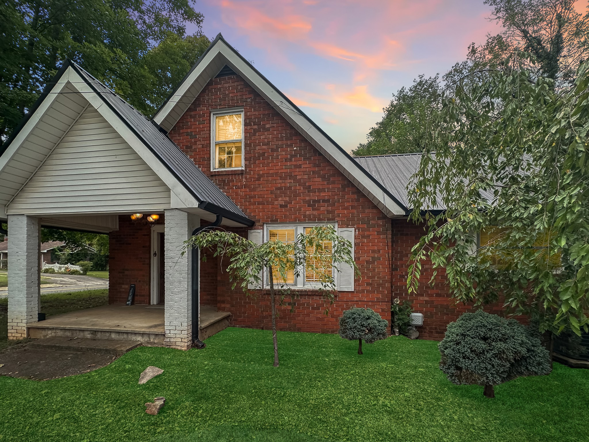 a front view of a house with garden