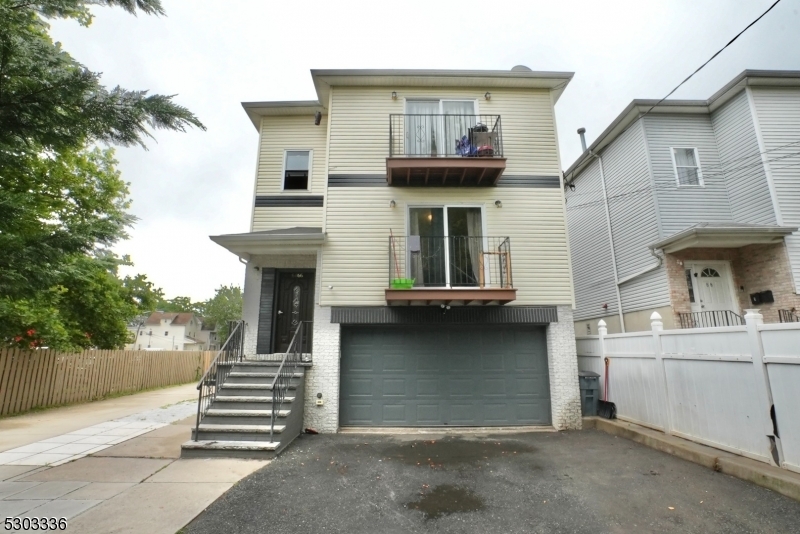 a view of a house with a street