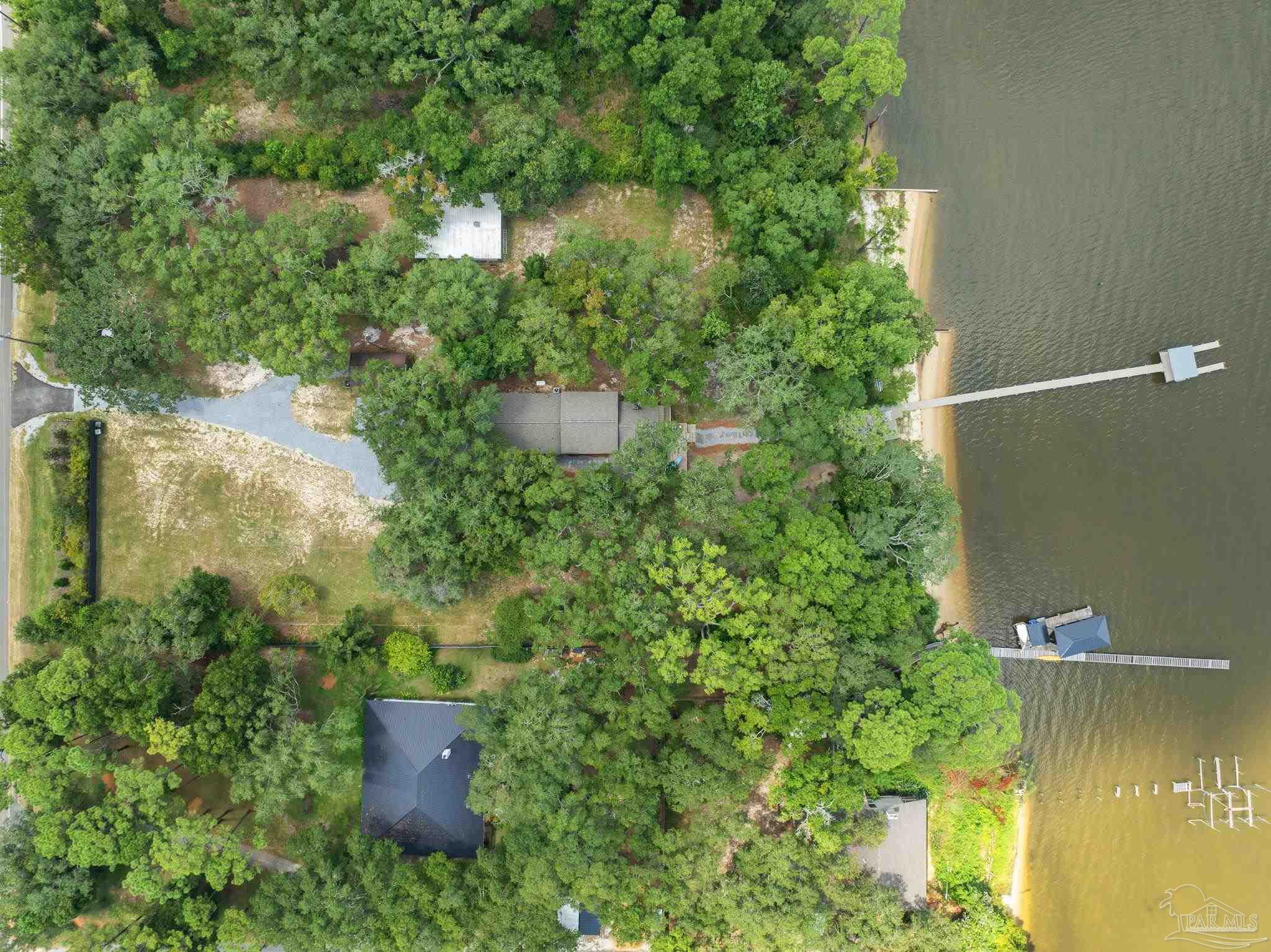 an aerial view of a house with pool yard outdoor seating and yard