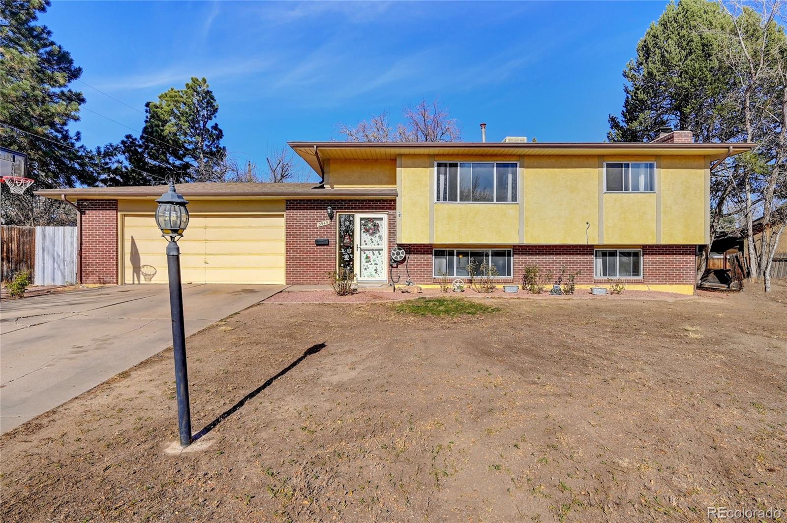 a view of a house with wooden fence