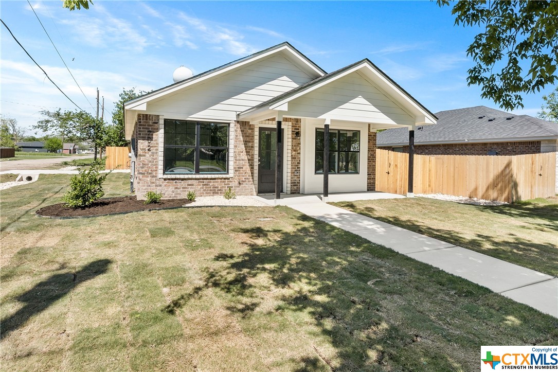 a front view of a house with a outdoor space