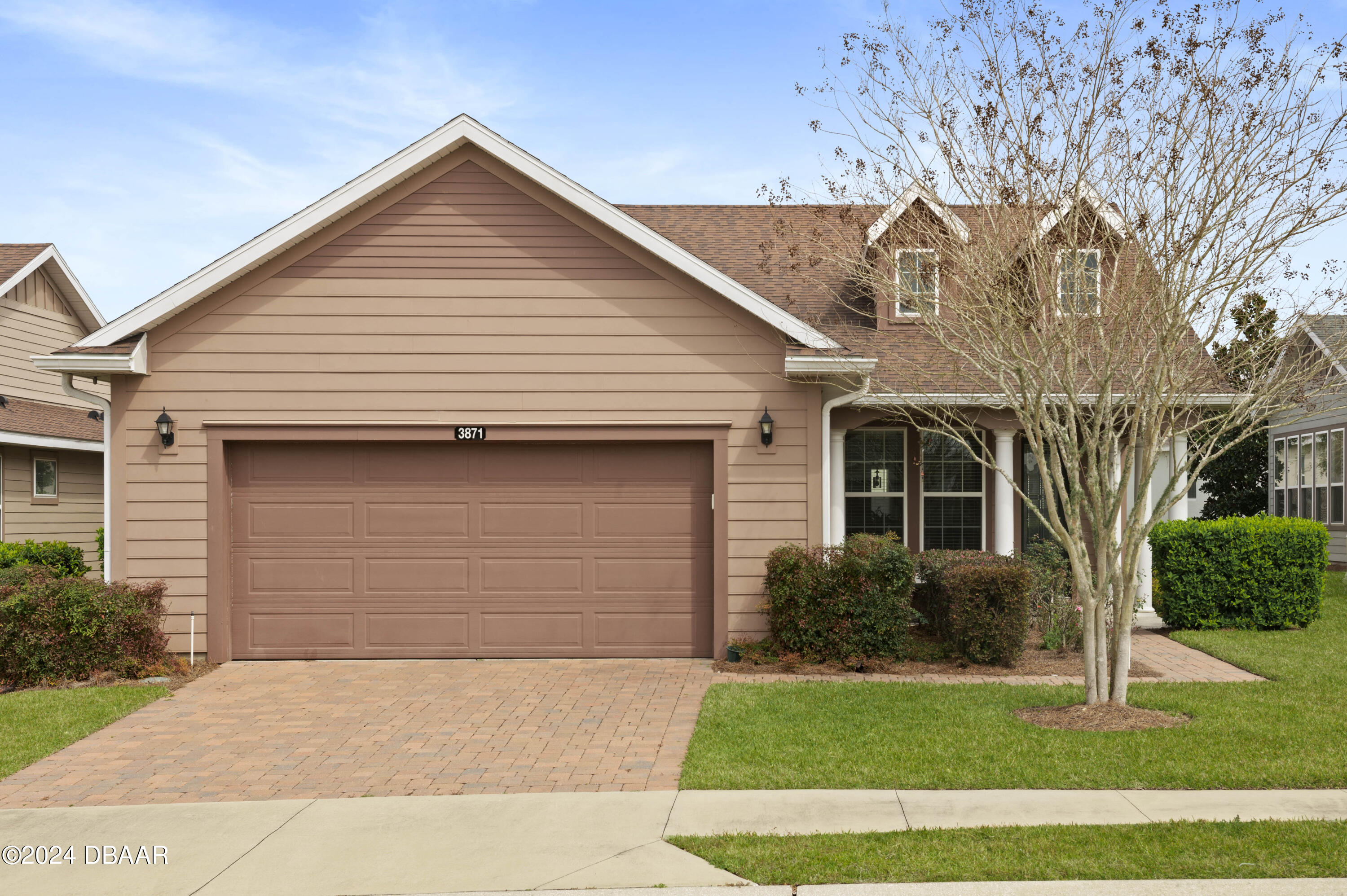 a front view of a house with a yard