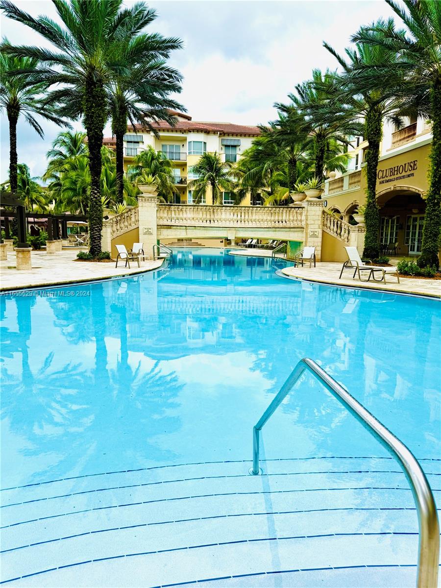 a view of a swimming pool and deck