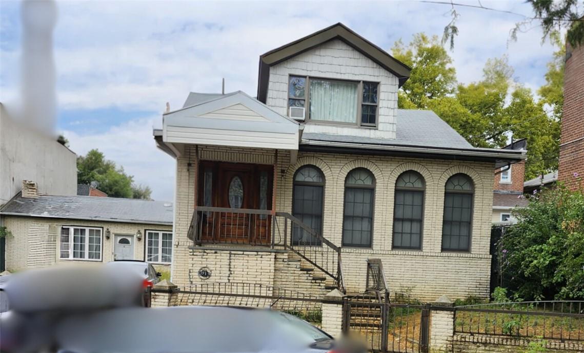 front view of residential house with a yard