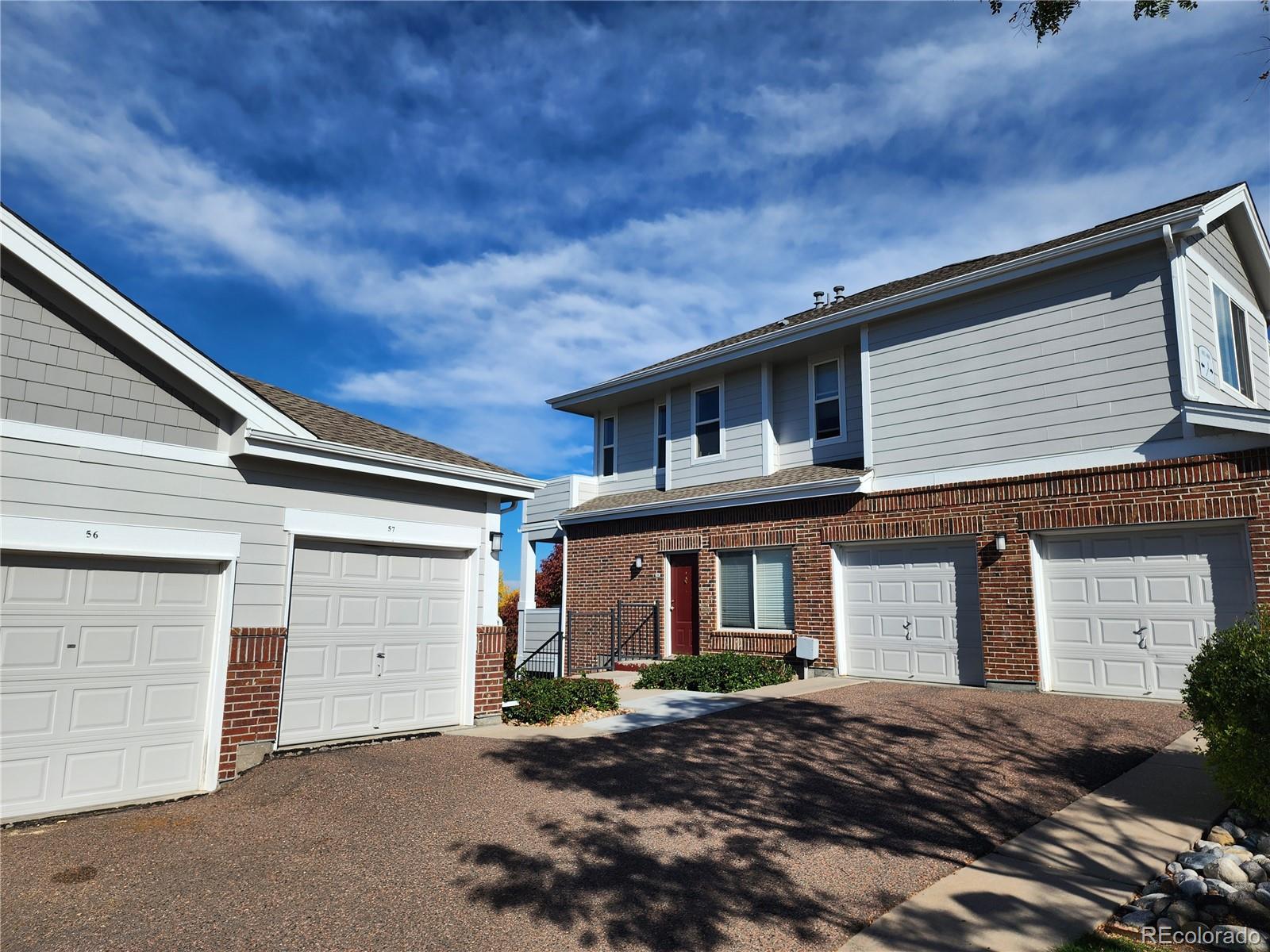 a front view of a house with a garage