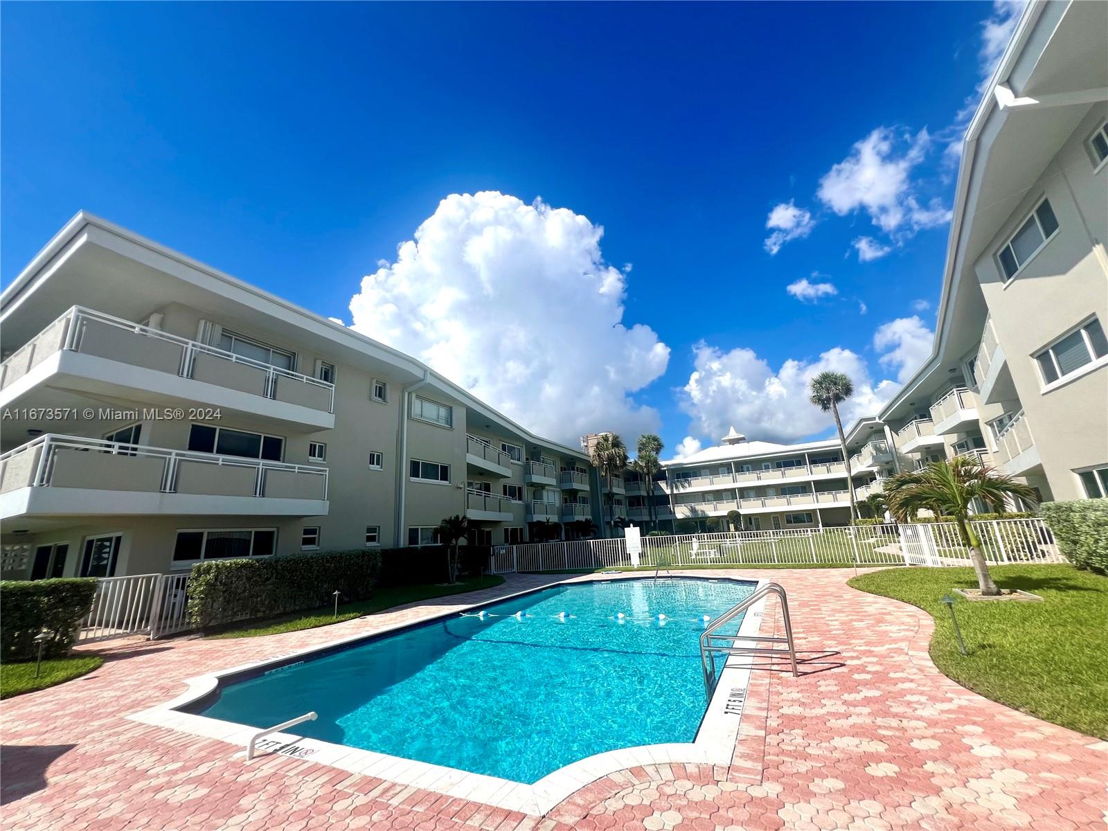 a view of a swimming pool with a patio