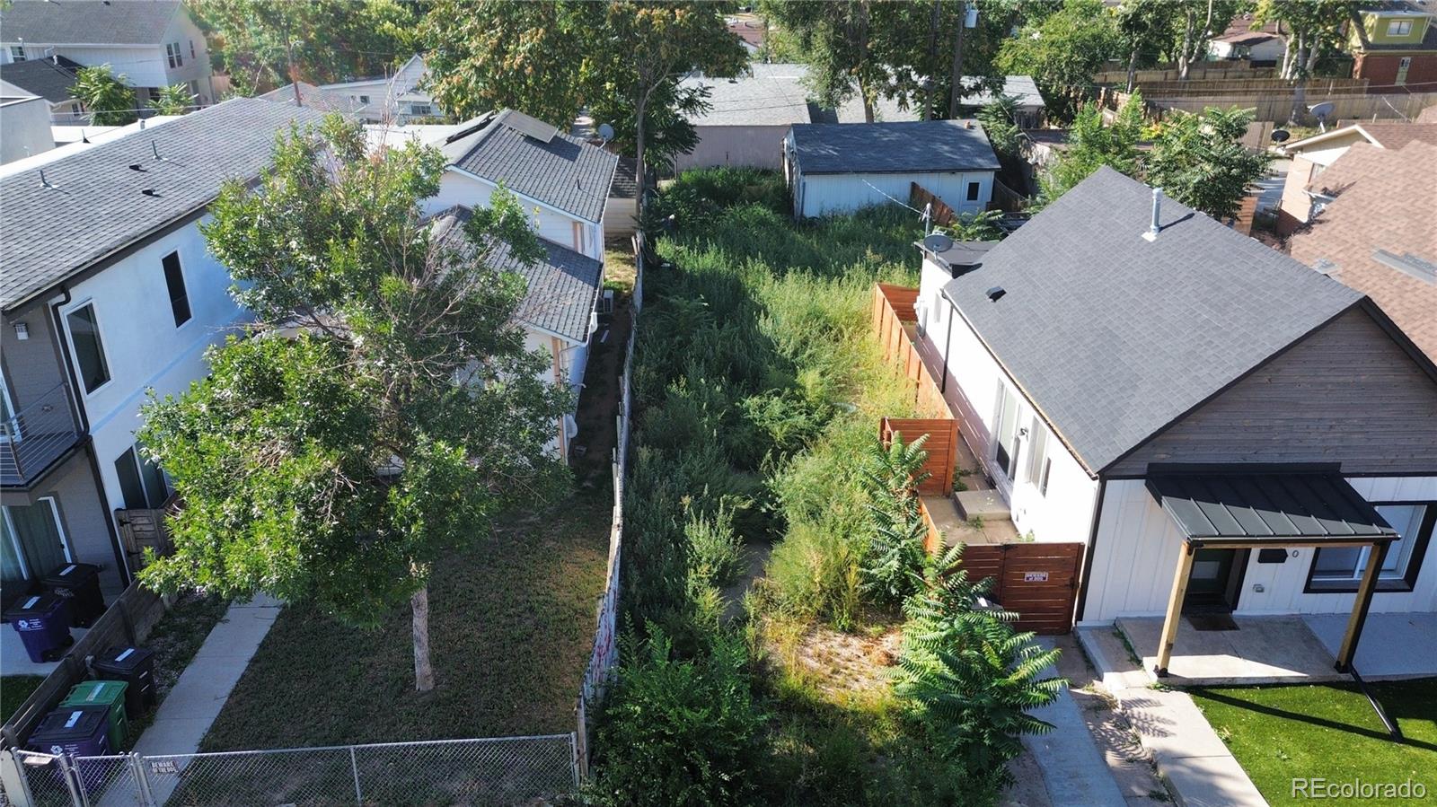 an aerial view of house with yard