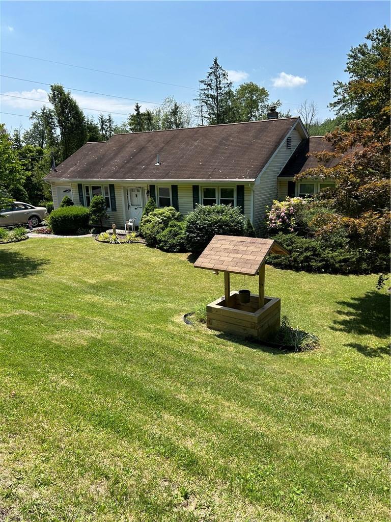 Ranch-style house with a front lawn