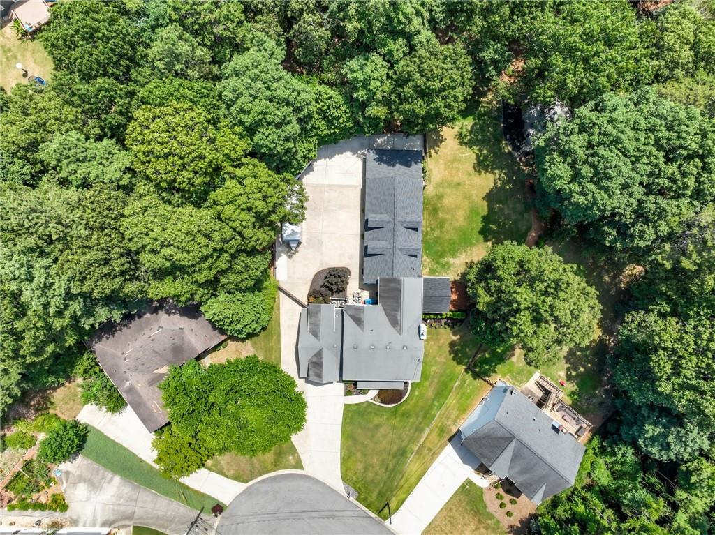 an aerial view of a house with outdoor space and street view