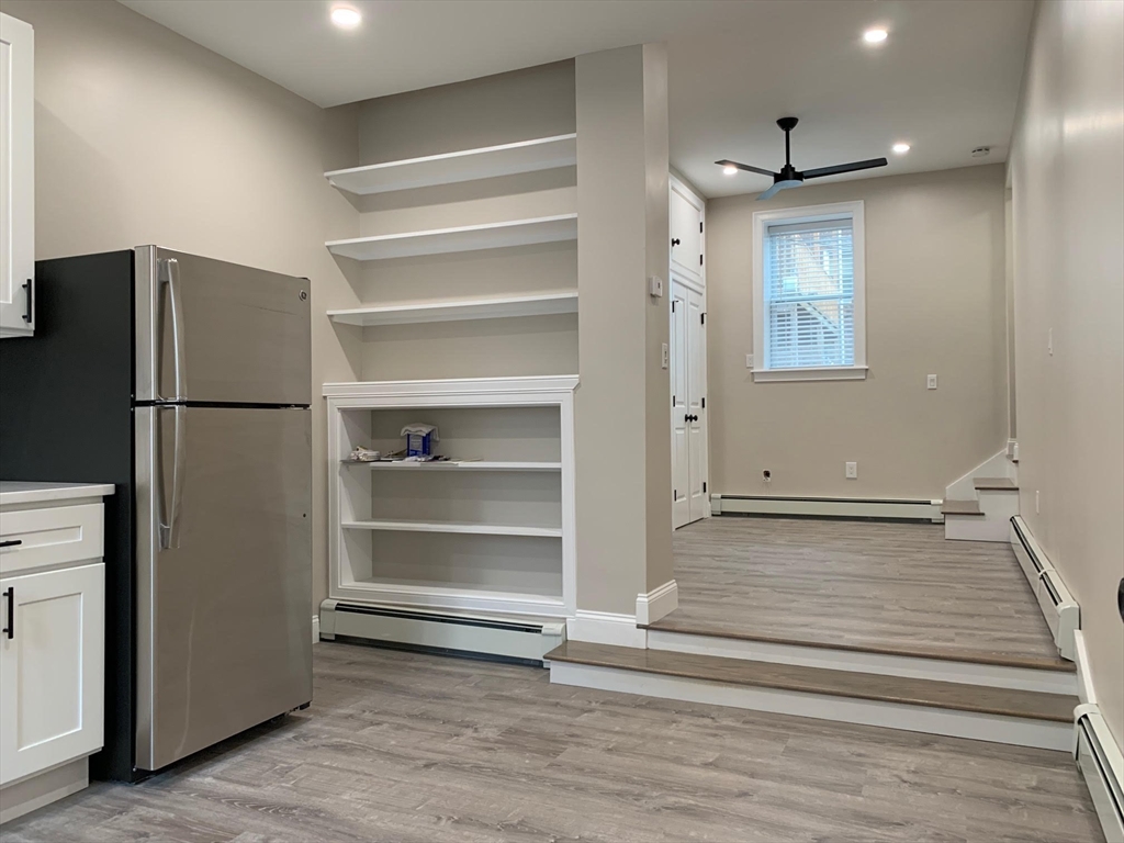 a bathroom with a refrigerator and a stove