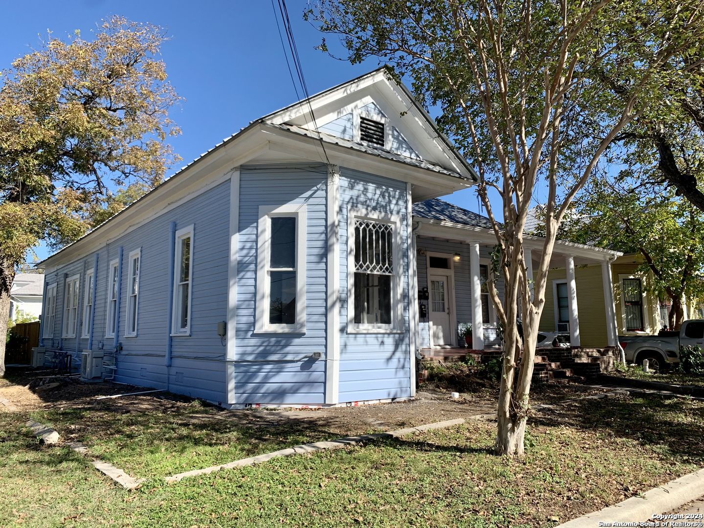 a view of a house with a small yard