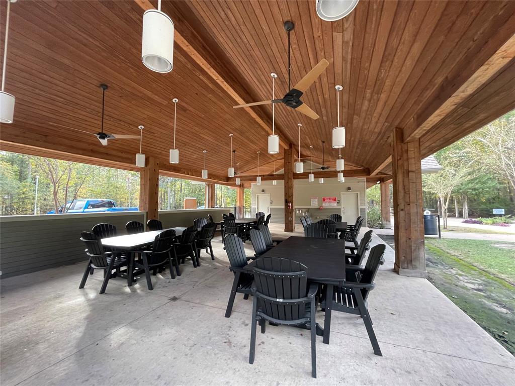 a view of a patio with a table and chairs