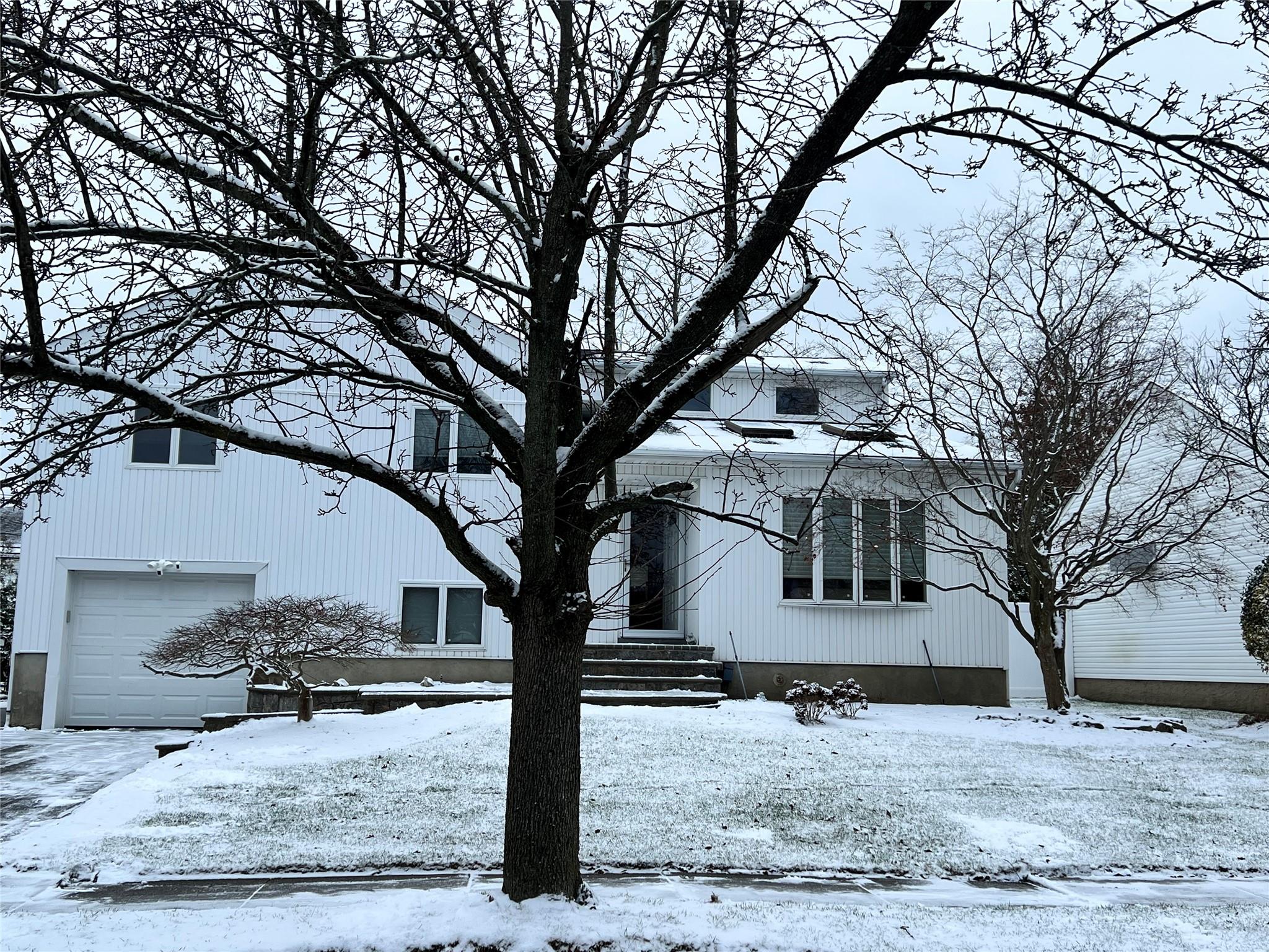 View of front facade with a garage