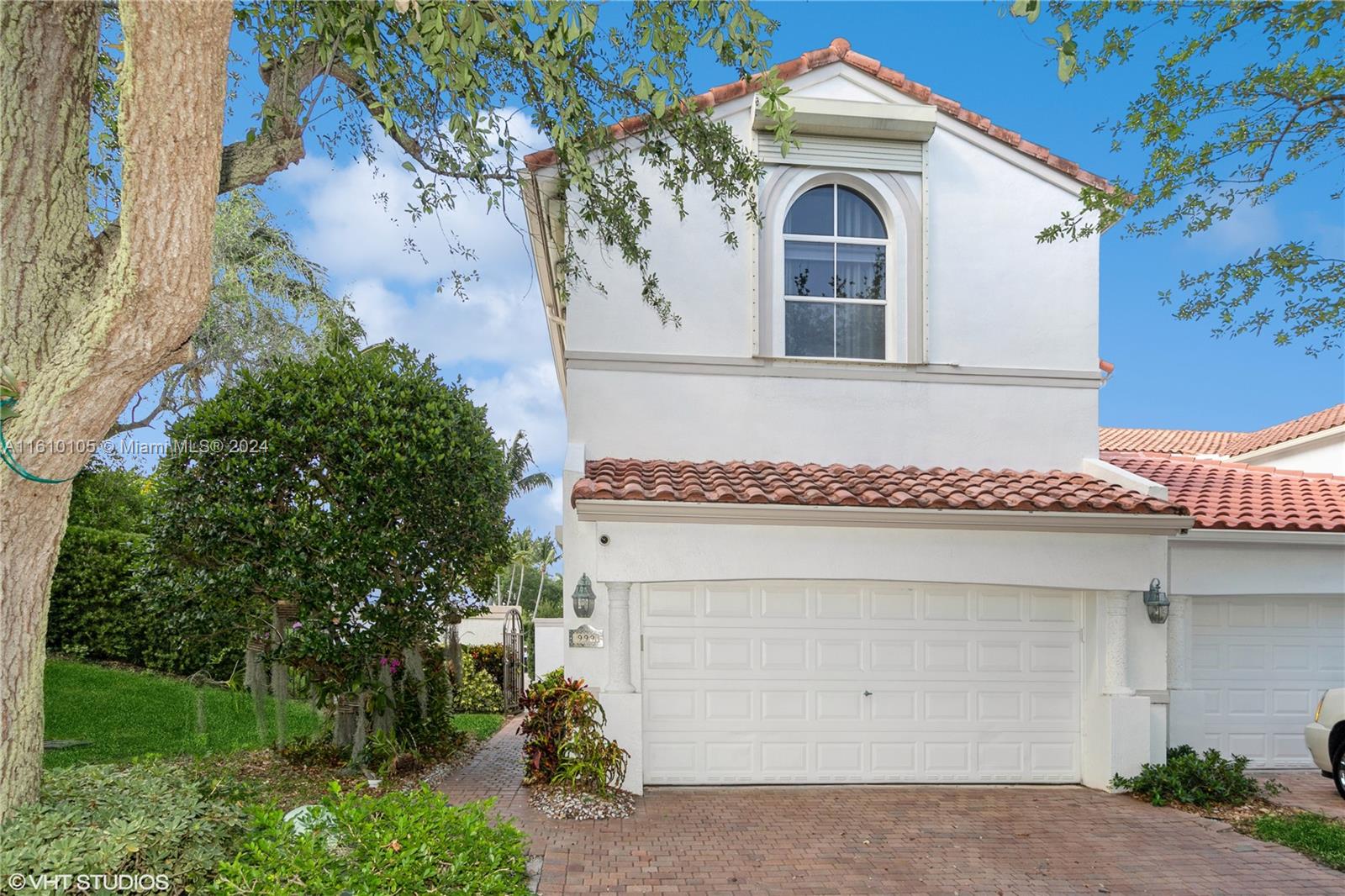 a front view of a house with a garage