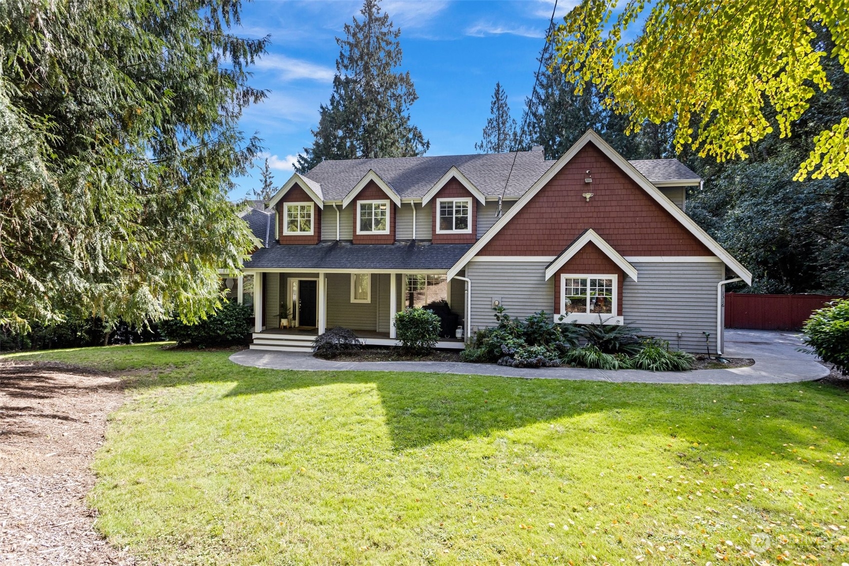 a front view of house with yard and green space