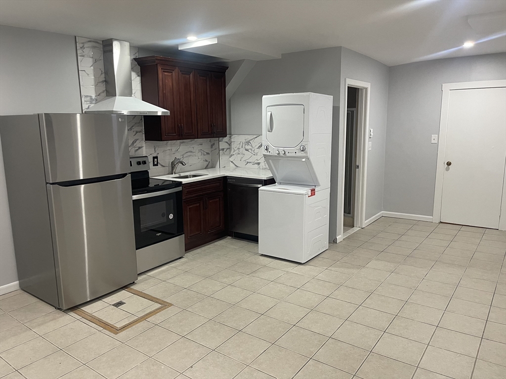 a kitchen with stainless steel appliances a refrigerator sink and cabinets