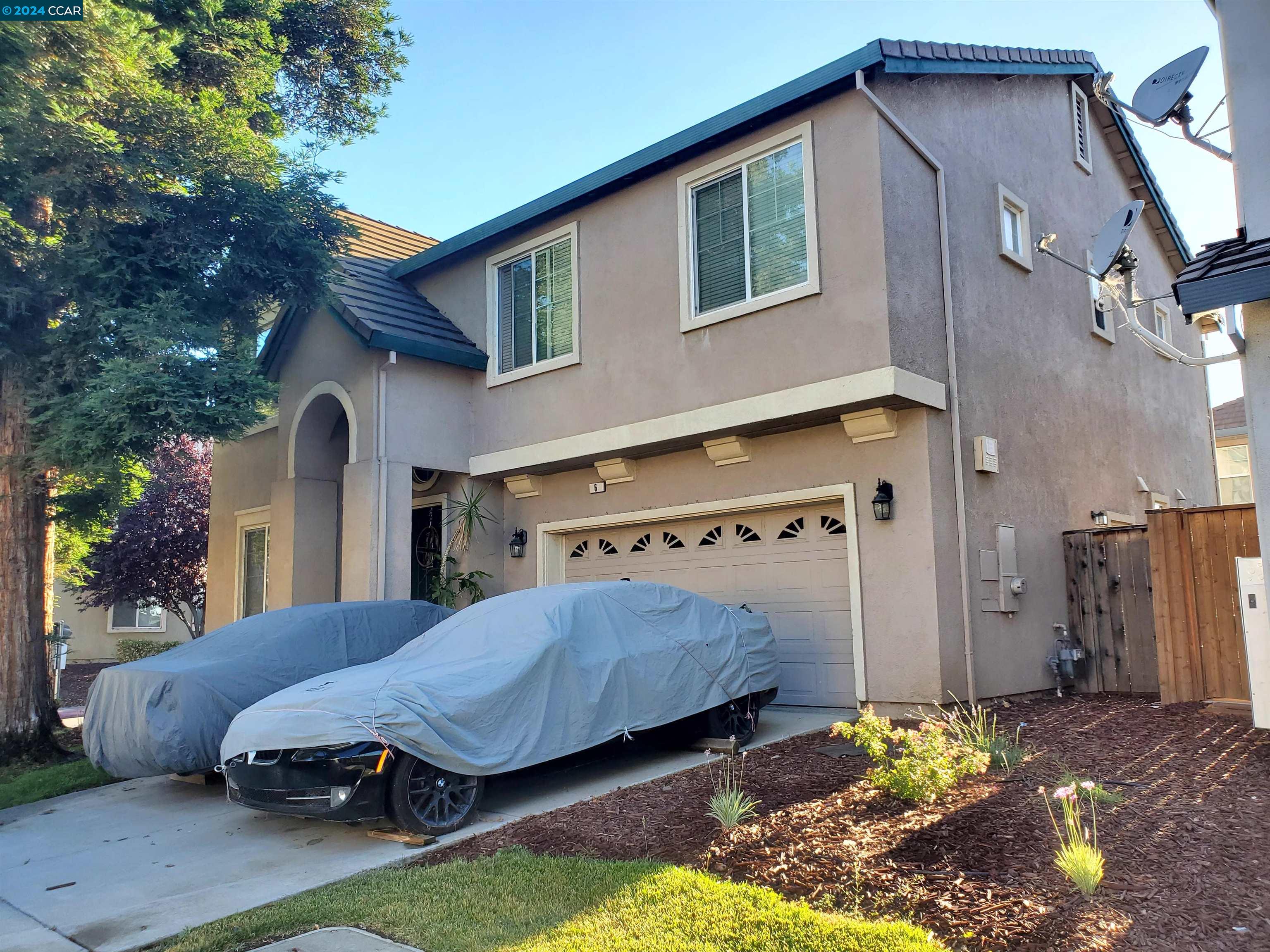 a view of a house with backyard tub and outdoor seating