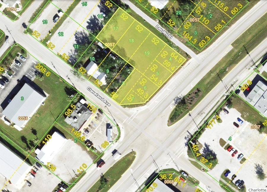 an aerial view of a house a garden and a blue umbrella