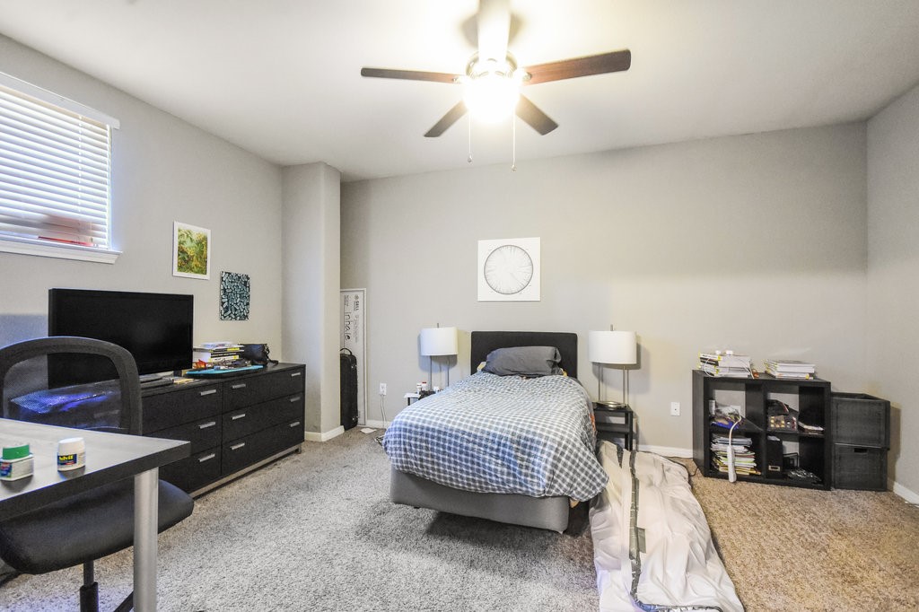 a bedroom with bed and a fireplace