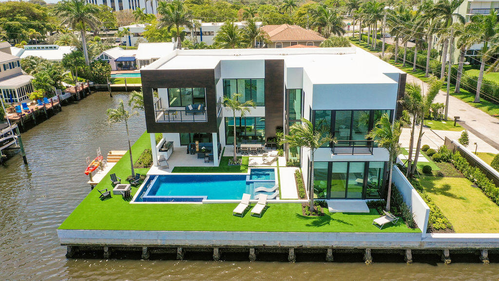 a view of house with a swimming pool