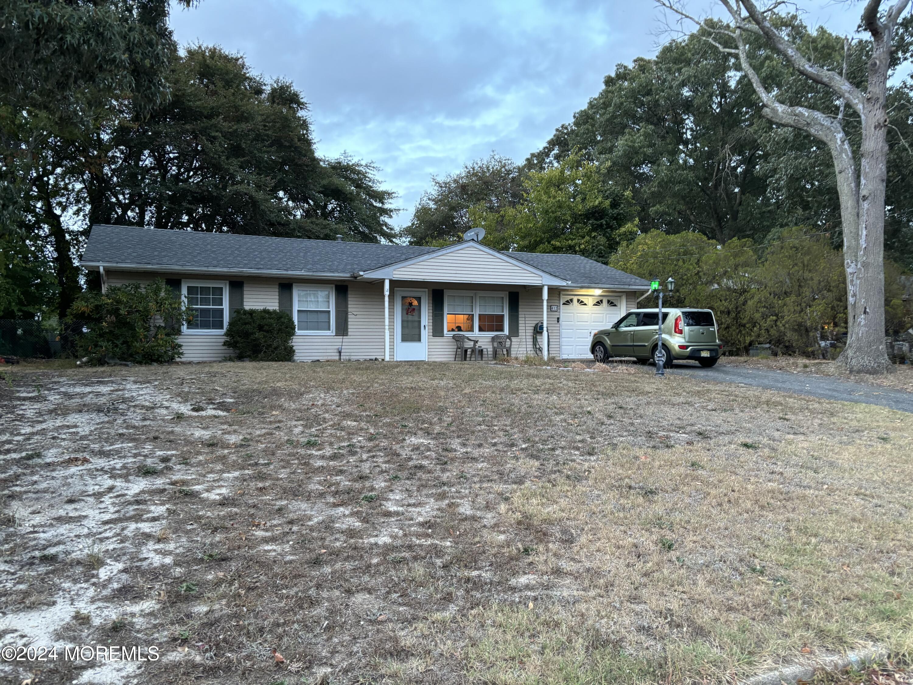 front view of a house with a yard