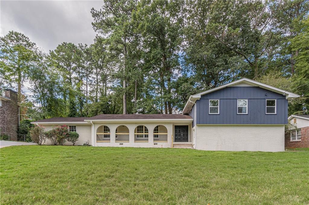 a front of a house with a yard