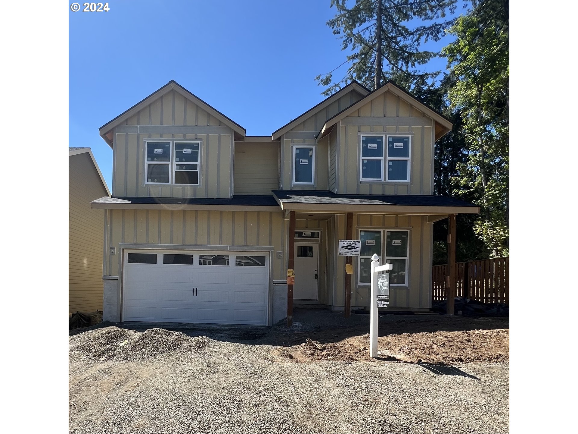 a front view of a house with garage