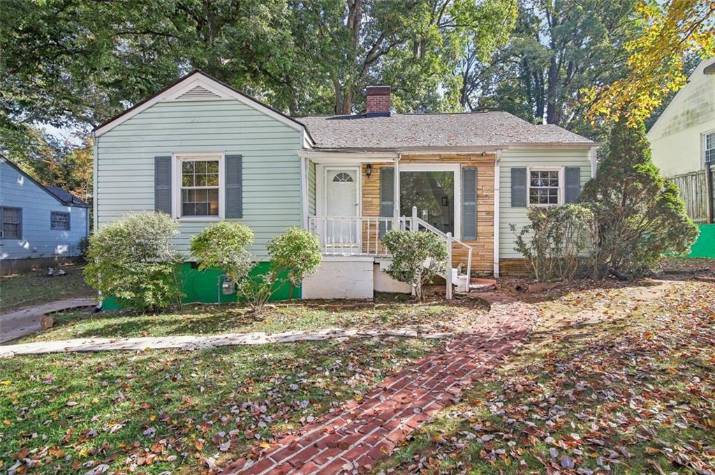 a view of a house with a yard and plants