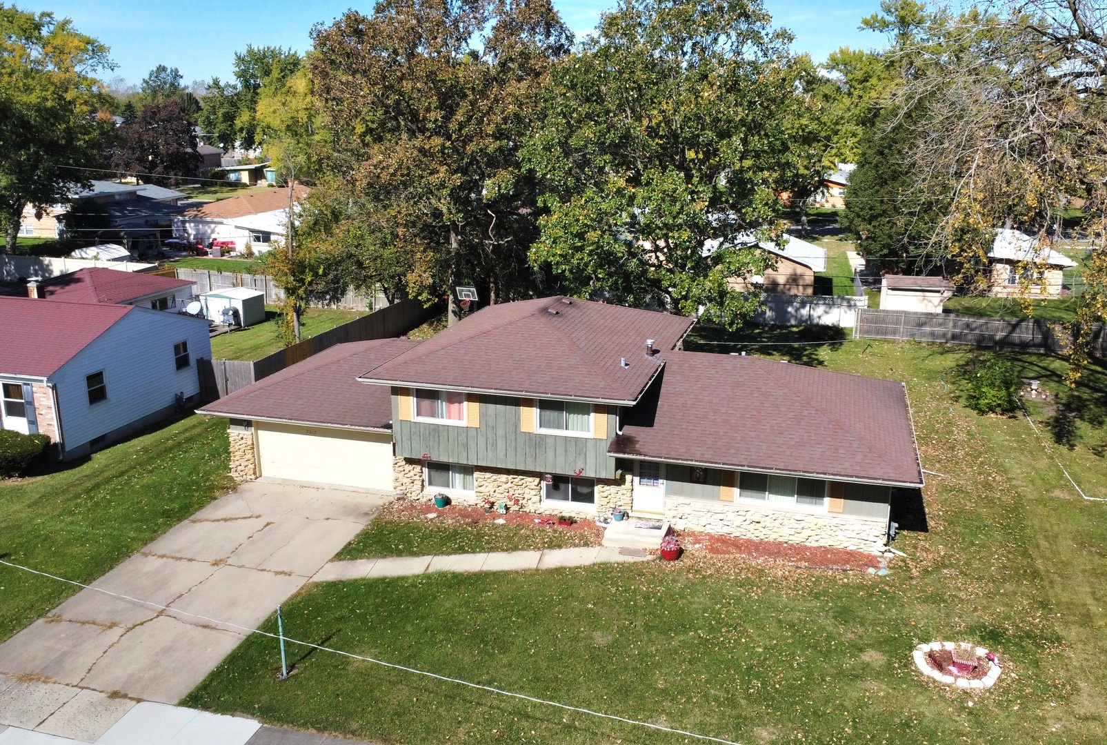 a aerial view of a house with yard and street view