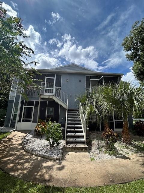 a front view of house with yard and outdoor seating