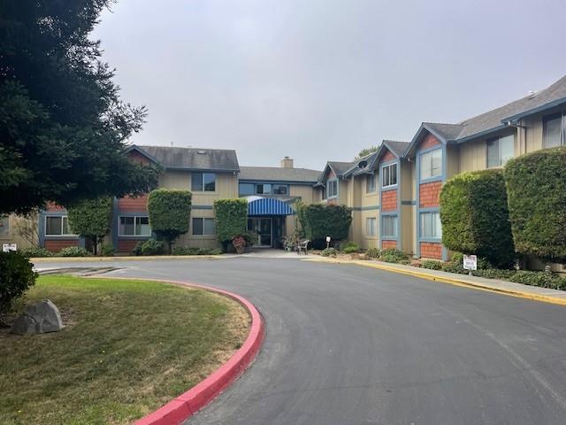 a front view of a building with street view