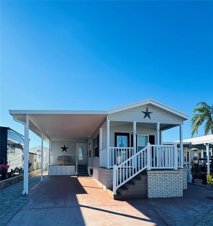 a view of a house with wooden deck