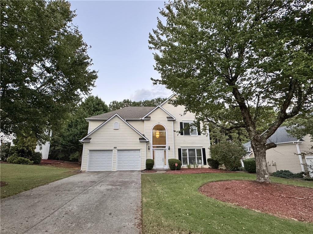 front view of a house with a yard