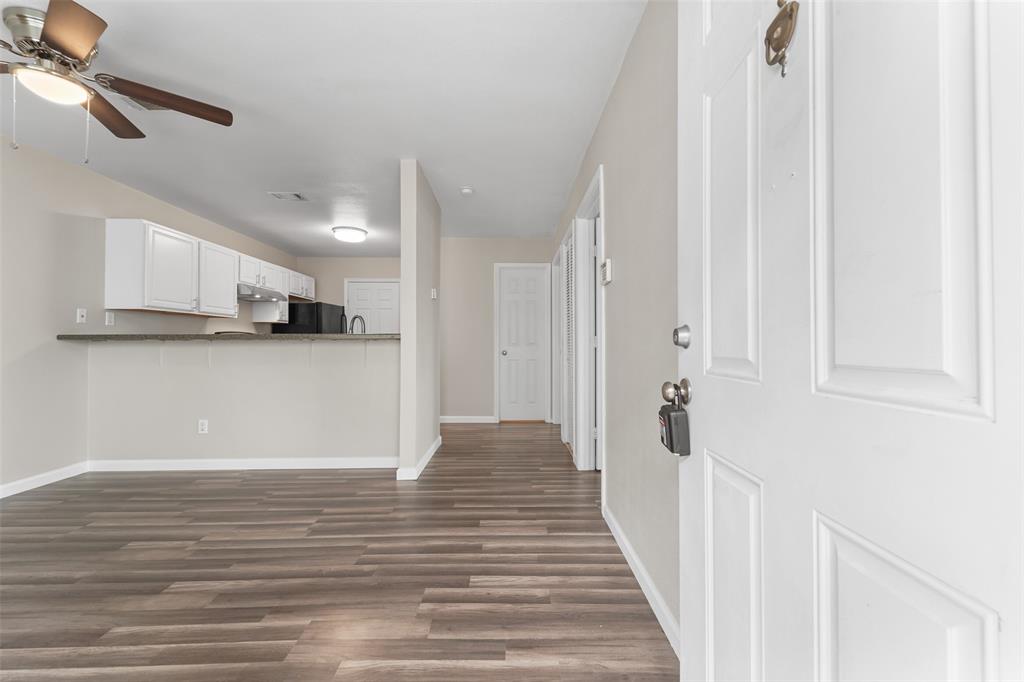 a view of a kitchen from the hallway