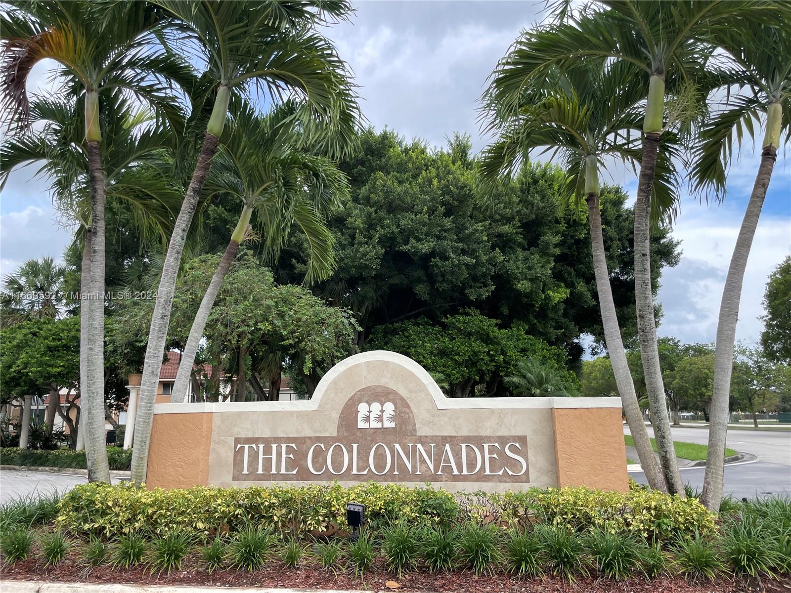 a view of outdoor space with sign board and garden