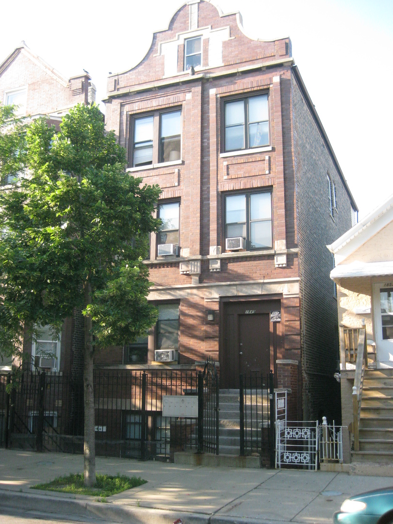 a front view of a building with pathway