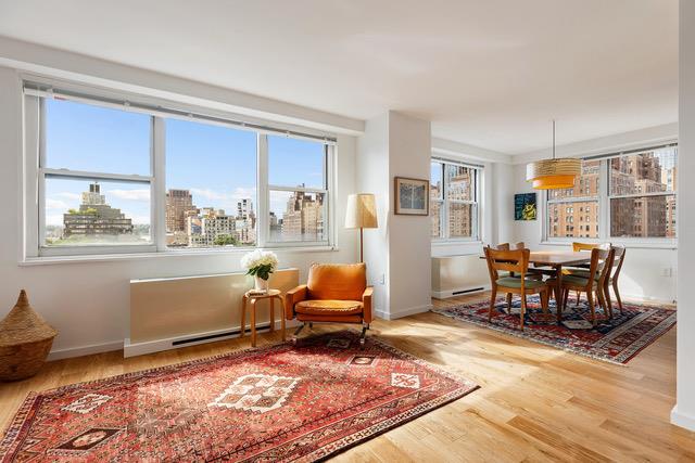 a living room with furniture rug and window