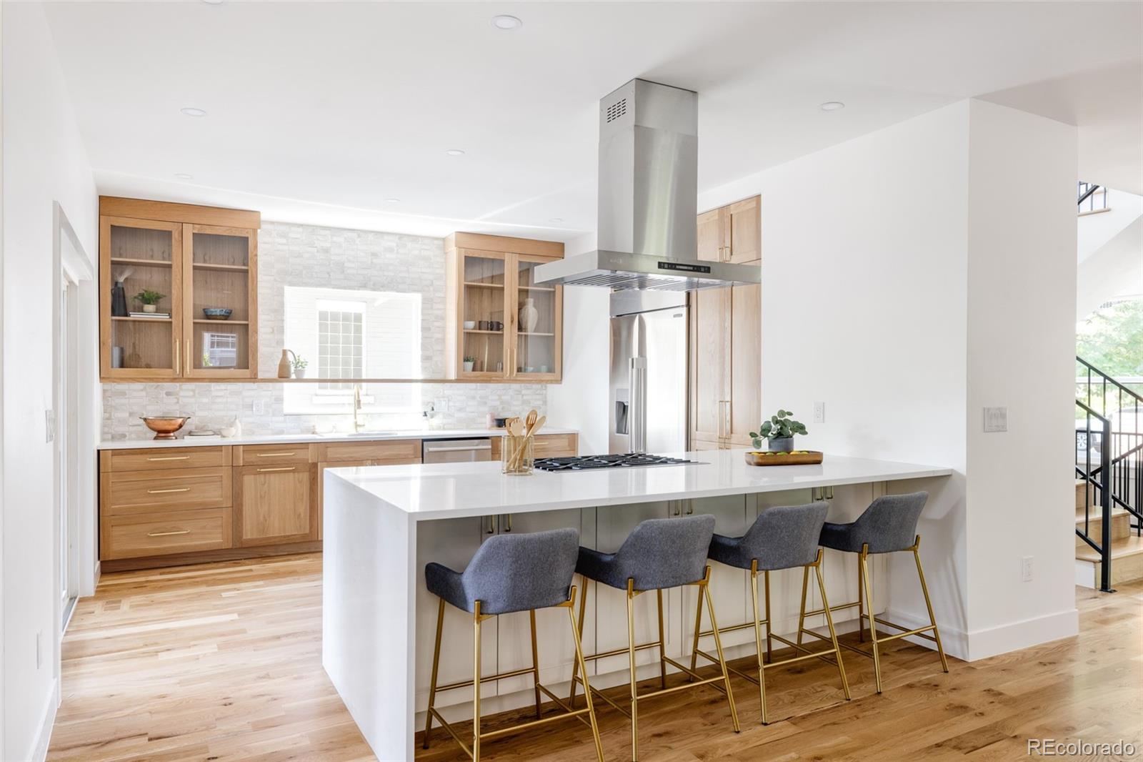 a kitchen with a sink cabinets and window