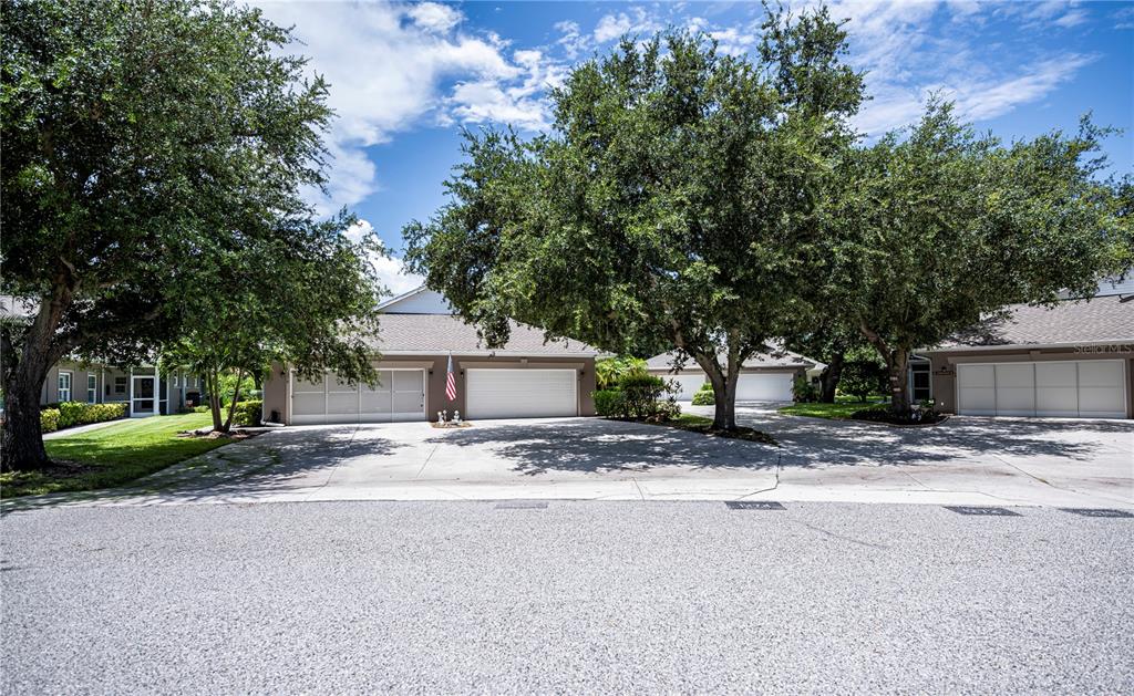 a view of a house with a yard and garage