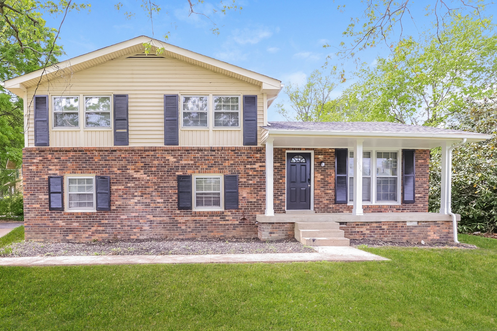 front view of a house with a yard